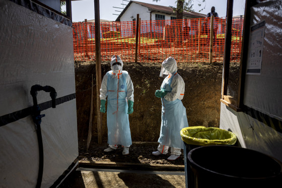Health workers wearing protective equipment walk through the isolation area of a newly established Ebola treatment center at the Evangelical Medical Center in the Rwampara Health Zone on May 31, 2026 in Bunia, Democratic Republic of Congo.
