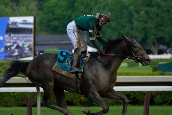 Jockey Jose Ortiz celebrates as he crosses the finish line aboard Golden Tempo to win the 158th running of the Belmont Stakes.