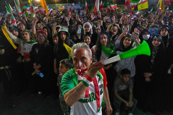 A man blows a plastic trumpet during a rally in support of Iran's World Cup team in Tehran on May 13, 2026.