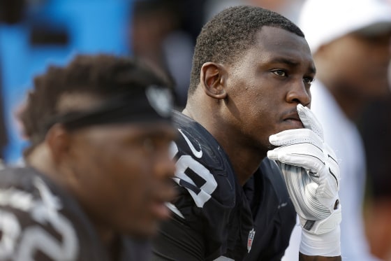 Aldon Smith, then playing for the Raiders, sits on the bench during the second half of the team's game on Sept. 13, 2015. Smith also played for the Seahawks and the 49ers, who announced his death on Saturday.