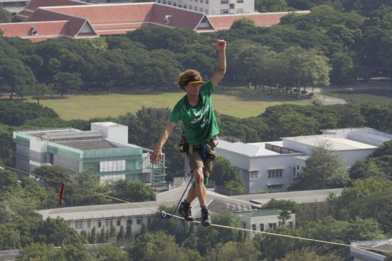 Slackliner Andy Lewis balances 555 feet over Bangkok in 2014.
