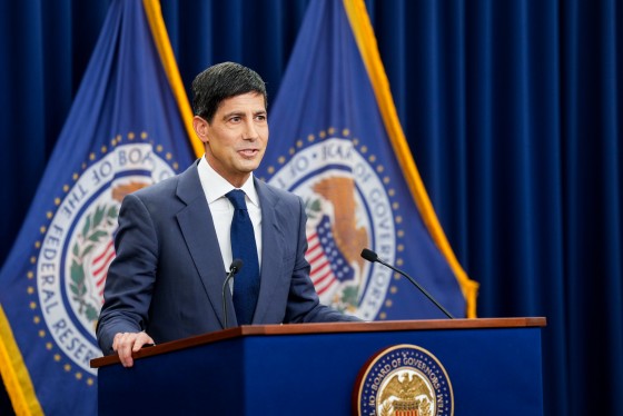 Kevin Warsh speaks at a podium