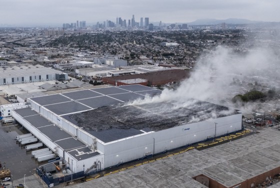 Image: The roof continued to smolder at a Lineage Logistics cold storage facility in Boyle Heights, Los Angeles, on June 18, 2026.