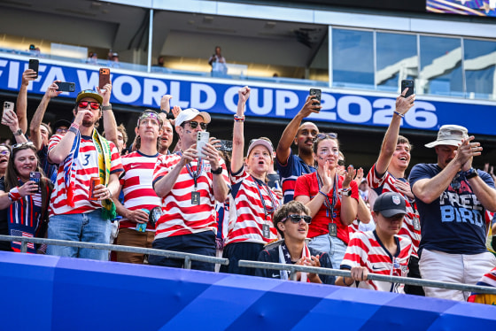 Fans of USA cheer their team from the stands