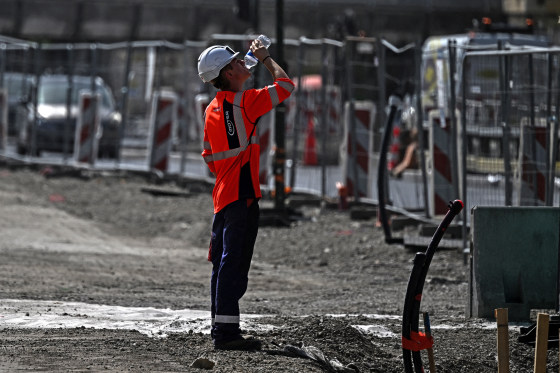 A worker drinks water a construction site in Bordeaux, southwestern France on June 22, 2026, as France experiences a ferocious heatwave.