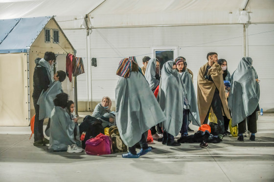 Migrants seen sheltering in the first aid camp