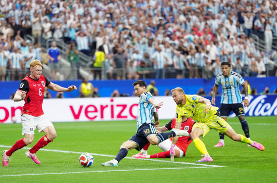 Lionel Messi of Argentina shoots to score his second goal against Austria 