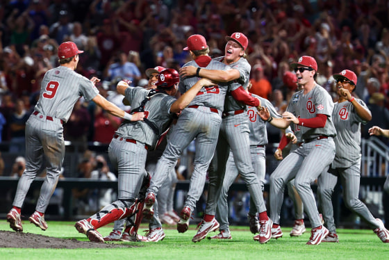 Oklahoma Sooners jump on each other in celebration