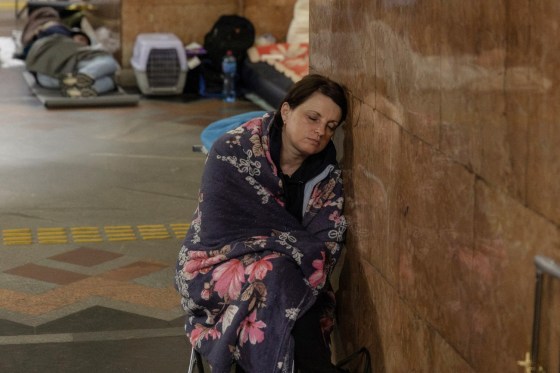 People take shelter at a metro station during Russian air attacks on Kyiv, Ukraine, early Thursday.