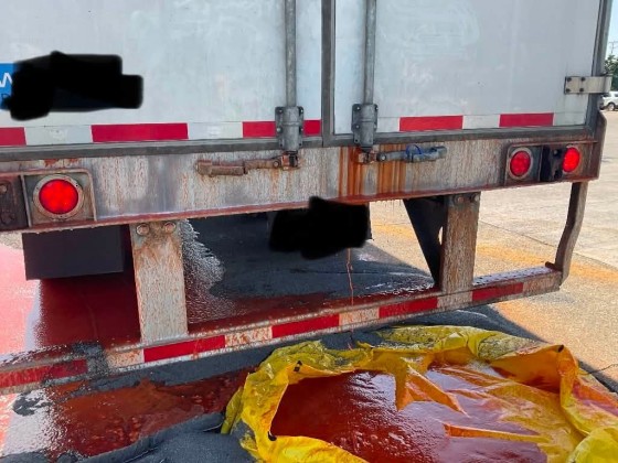 Image: A semi-truck carrying 40,000 pounds of Frank's RedHot stopped at a truck stop in Ohio after leaking red liquid, authorities said.