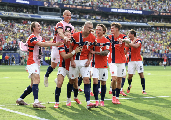 Team Norway celebrating on the pitch during a world cup match.