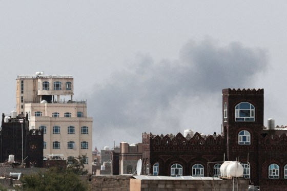 Smoke rises after reports of an airstrike hitting near the Sanaa International Airport