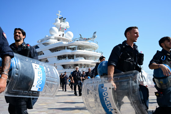 Police officers in front of US Ambassador to Italy Tilman Fertittas's megayacht.
