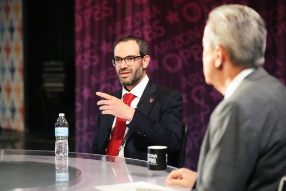 Alex Kolodin speaks while seated at a roundtable
