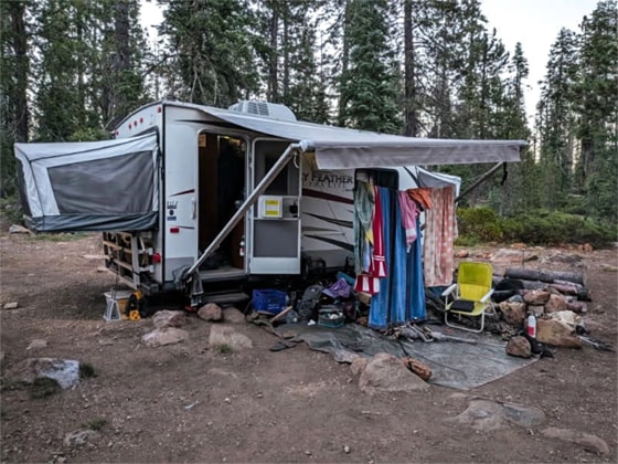 The camping trailer inhabited by Joseph and Phoenix Henrichsen, parked on a road near Gumboot Lake Campground in California.