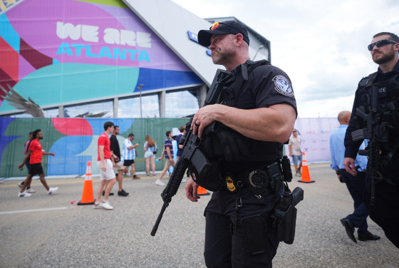 Police officers outside the Atlanta Stadium in Atlanta, Georgia, ahead of the 2026 FIFA World Cup semi-final match between England and Argentina on July 15, 2026. 
