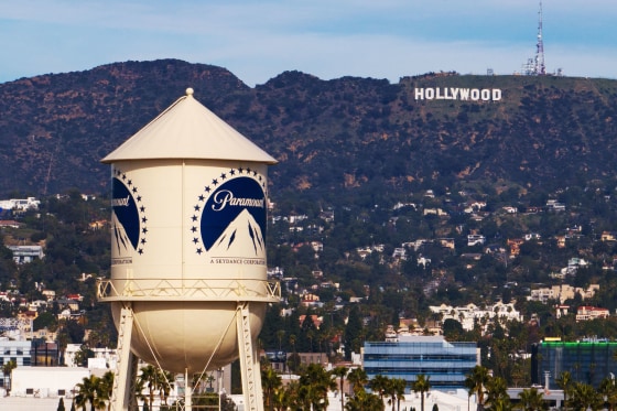 The Paramount Pictures water tower in Los Angeles with the Hollywood sign in the distance.