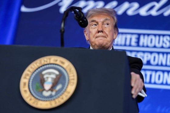 President Trump Delivers Remarks at a podium bearing the presidential seal.