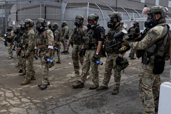 ICE agents standing outside the Delaney Hall Detention Facility in Newark, New Jersey.