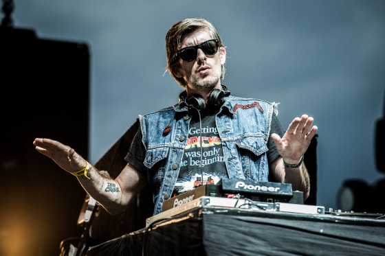 Kavinsky dances at a DJ Booth