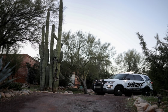 A Pima County Sheriff's vehicle parks in the driveway of the home of Nancy Guthrie in Tucson.