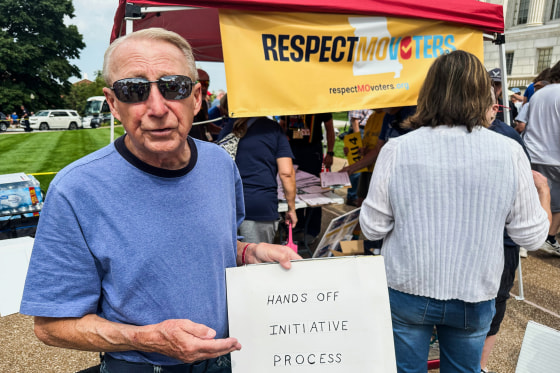  a sign explaining his opposition to a state legislative proposal that would make it harder for voters to approve citizen-initiated constitutional amendments 