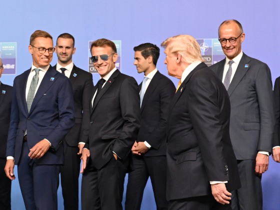 Emmanuel Macron poses with other heads of state and government for a family photo during the 36th NATO Heads of State and Government Summit.