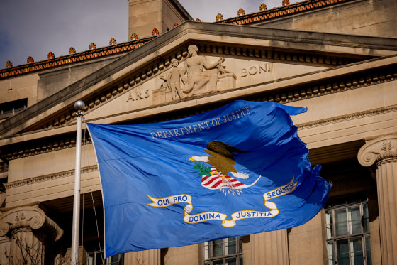 A flag outside the Robert F. Kennedy Department of Justice Building.