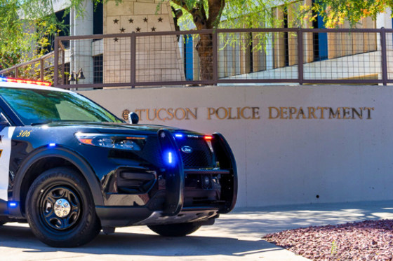 A police car parked in front of the Tucson Police Department