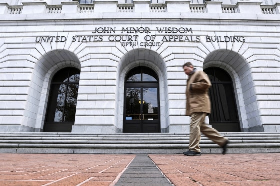 A man walks in front of the 5th U.S. Circuit Court of Appeals.