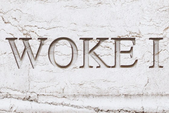 An illustration of "Woke I" carved into marble.