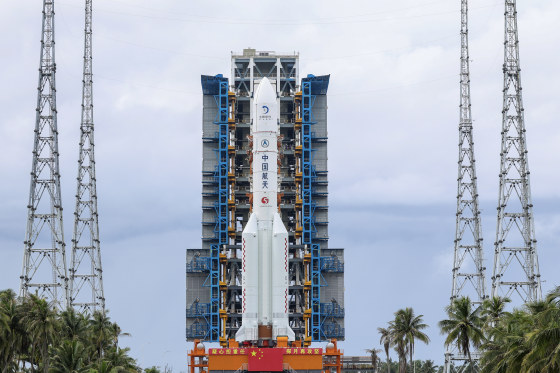 A rocket and booster are displayed upright 