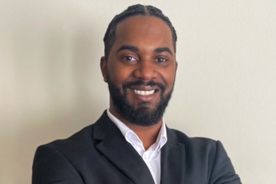 Anthony Baines smiles for a headshot