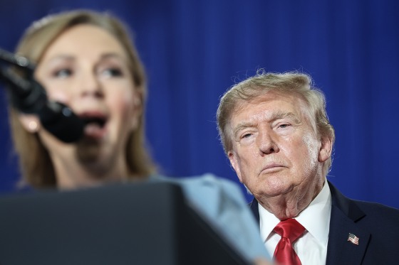 U.S. President Donald Trump listens to U.S. Sen. Darline Graham speak