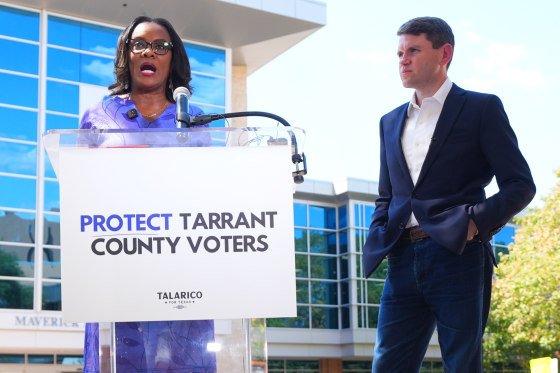 Democratic Senate candidate James Talarico, right, looks on as Tarrant County Commissioner Alisa Simmons speaks during a news conference at UTA.