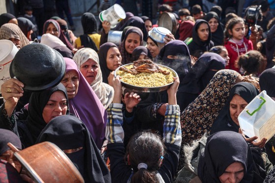 People gather to receive food.