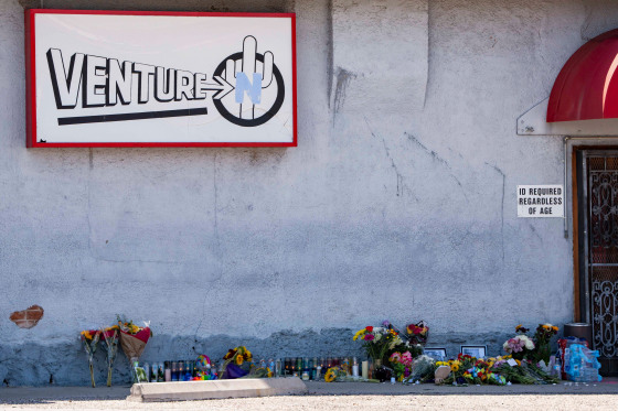 A memorial sits outside Venture-N Bar.