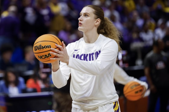Kate Koval #13 of the LSU Tigers warms up before a basketball game.
