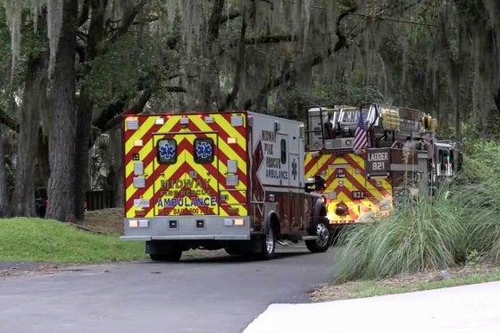 Two Midway ambulances are seen parked in the street.