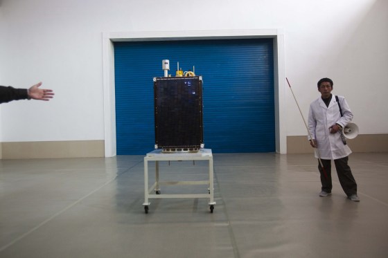 The satellite that North Korean officials say will be launched with the country's Unha-3 rocket, slated for liftoff between April 12-16, is shown to the media at Sohae Satellite Station in Tongchang-ri, North Korea on April 8. North Korean space officials have moved a long-range rocket into position for this week's controversial satellite launch, vowing Sunday to push ahead with their plans in defiance of international warnings against violating a ban on missile activity.