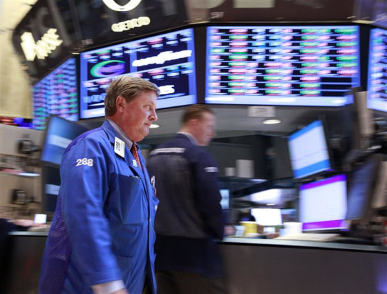 Traders work on the floor of the New York Stock Exchange.