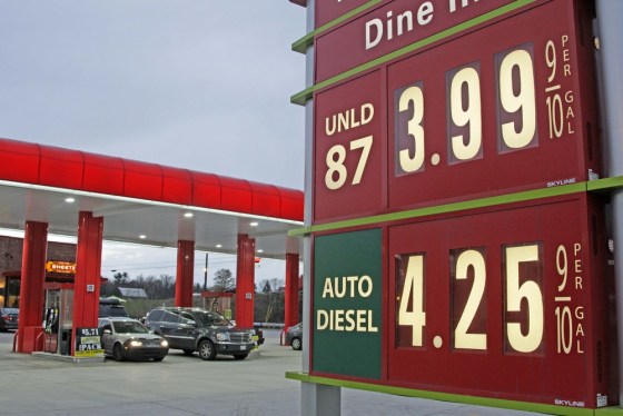 Gas prices are posted at a gas station in Breezewood, Pa., Falling gas prices helped lead to flat wholesale prices in March.