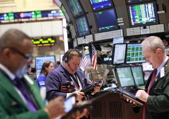 Traders work on the floor of the New York Stock Exchange.