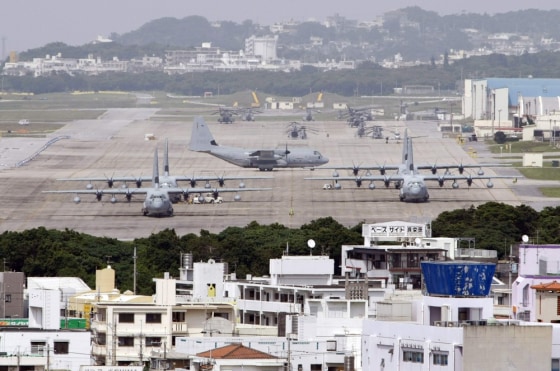 Hercules aircraft are parked on the tarmac at Marine Corps Air Station Futenma in Ginowan on Okinawa.