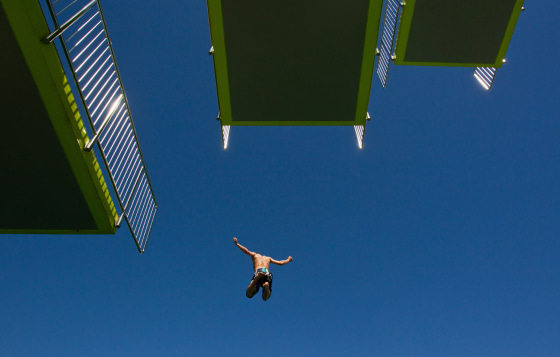 A man jumps into a swimming pool in the southern German city of Nuremberg on April 28, as temperatures rose to 82 degrees in many parts of the country.