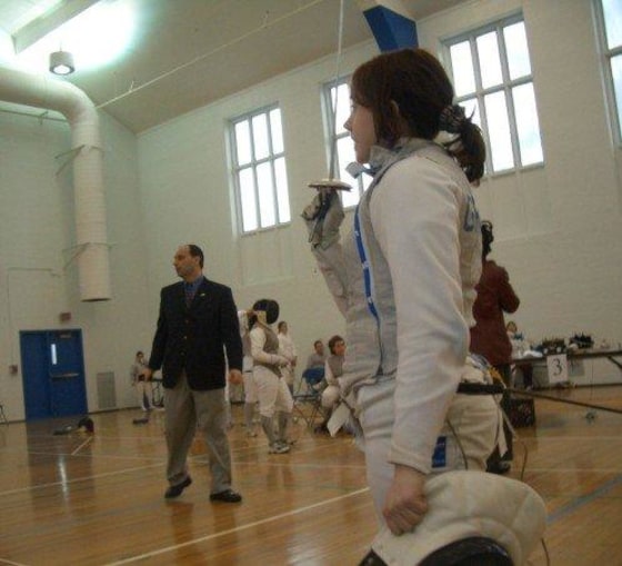 En garde! Here I am saluting my opponent before starting a college fencing meet as part of Tufts University's varsity team. There's nothing like the anticipation before a bout, saluting, putting on your mask and raising your foil!