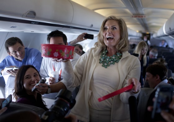 Ann Romney, wife of Republican presidential candidate, former Massachusetts Gov. Mitt Romney hands out cookies during a flight to Tampa, Tuesday, Aug. 28.