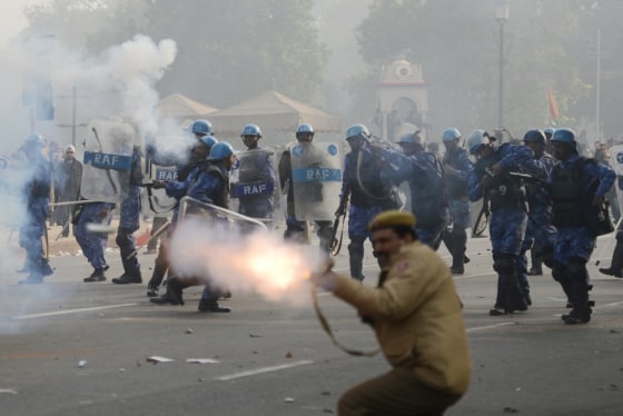 New Delhi police fire tear gas to quell the biggest protest so far at the rape of a student last week.