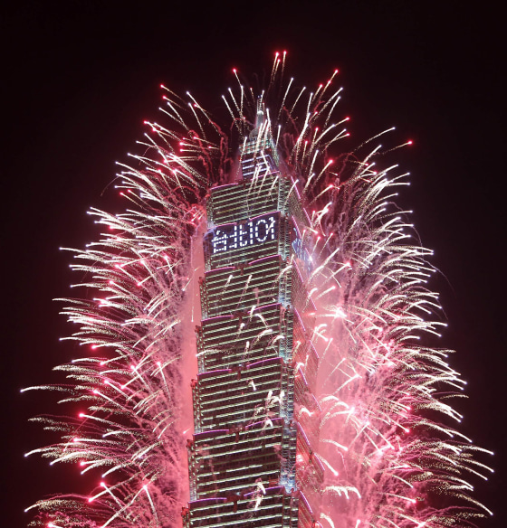 Fireworks explode from Taiwan's tallest skyscraper, the Taipei 101, during New Year celebrations in Taipei on Jan. 1, 2013. The Taipei 101, a 1,670-foot-high skyscraper (509 meters) ranked officially as the world's tallest from 2004 until the opening of the Burj Khalifa in Dubai in 2010. The Chinese characters read 'Taipei 101.'