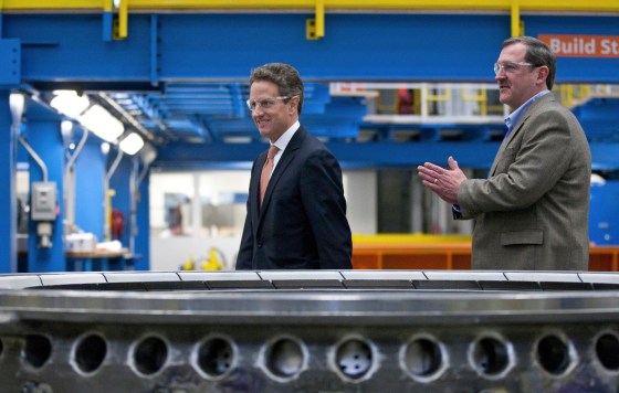 U.S. Treasury Secretary Timothy Geithner (L) walks with Siemens Energy Director of Operations Mark A. Pringle (R) during a visit to Siemens Energy's plant in Charlotte, North Carolina January 25, 2012. REUTERS/Chris Keane (UNITED STATES - Tags: BUSINESS ENERGY POLITICS)